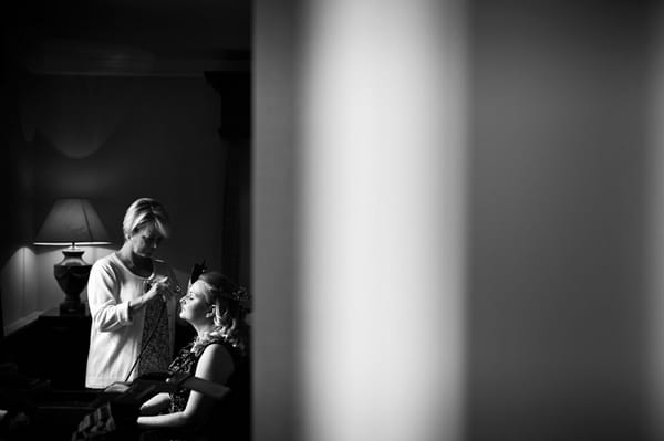 Bride having make-up done