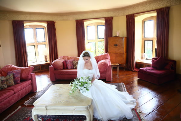 Bride sitting at coffee table