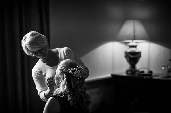 Bride having make-up done