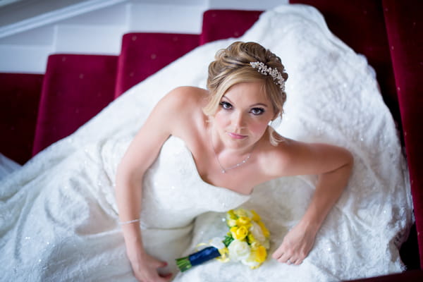 Bride laying on stairs