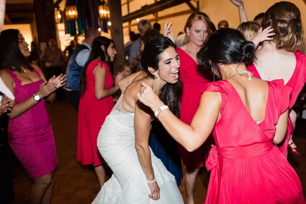 Bride dancing with bridesmaids