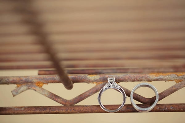 Wedding rings on rusty metal frame