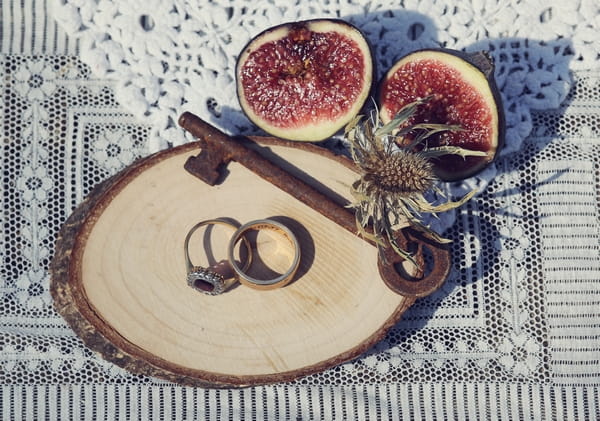 Key, wedding rings and figs