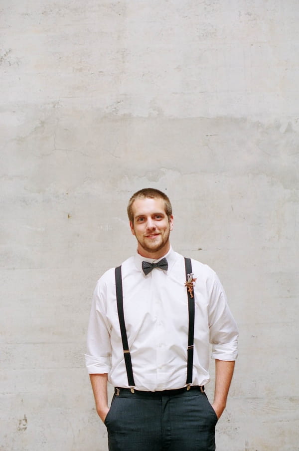 Groom with bow tie and braces