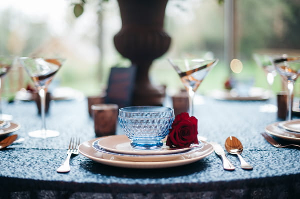 Blue glass bowl at wedding place setting