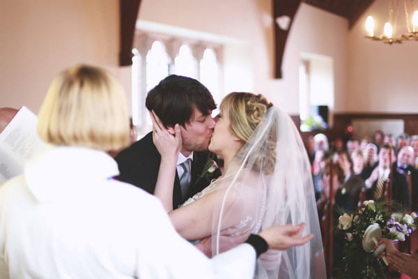 Bride and groom kiss