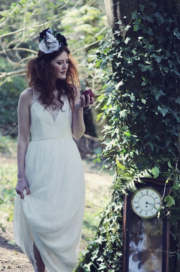 Bride standing next to clock