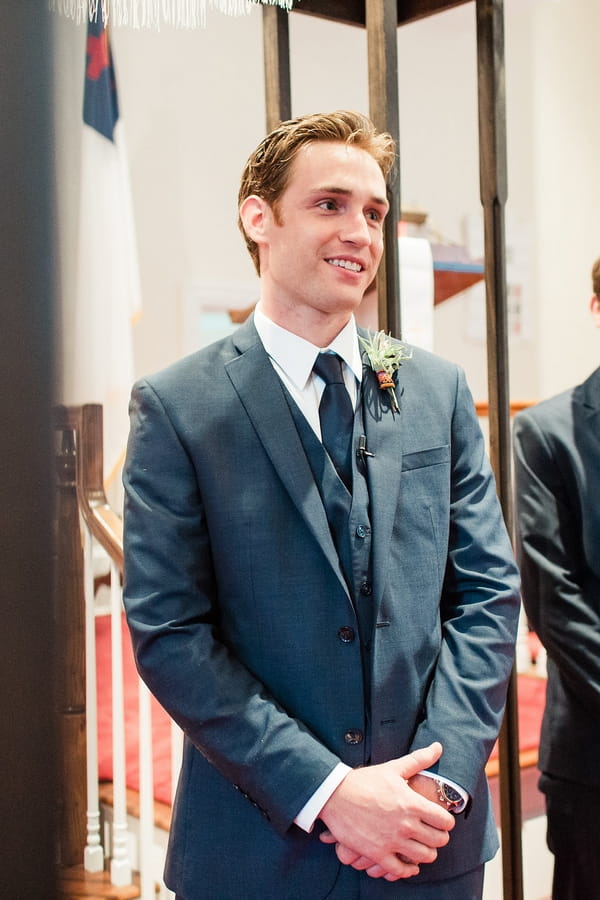 Groom waiting for bride at altar