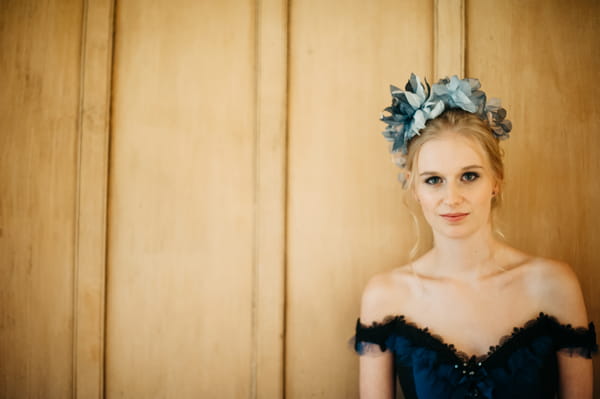 Bride with blue wedding dress and blue hairpiece