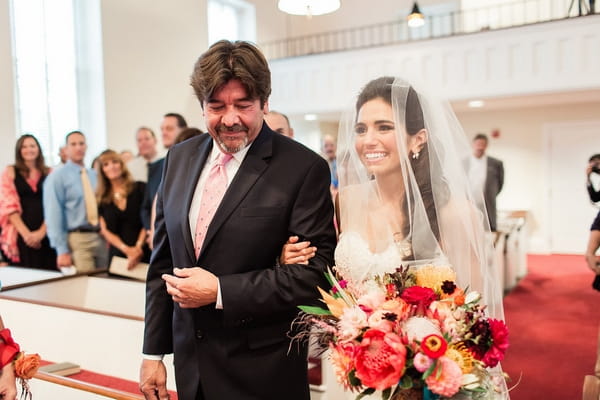 Father walking bride down aisle