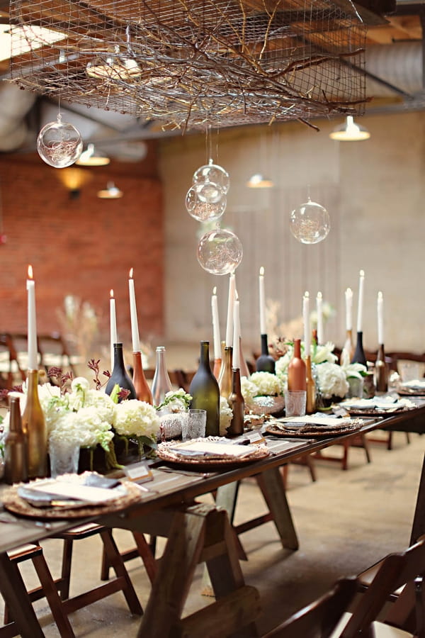 Bottles and candle wedding table decoration