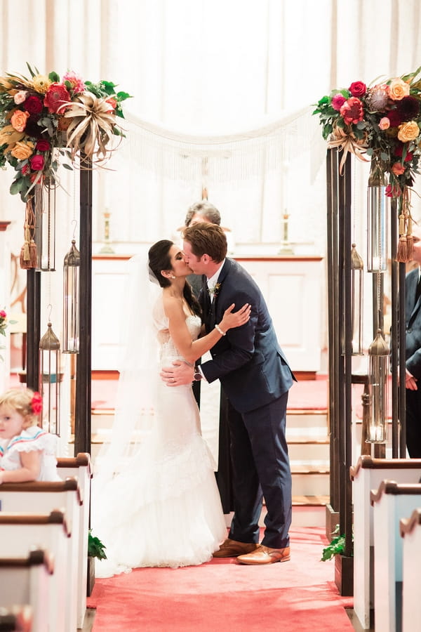 Bride and groom kiss