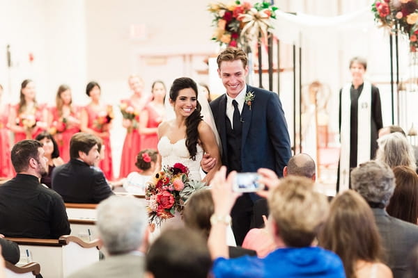 Bride and groom leaving ceremony