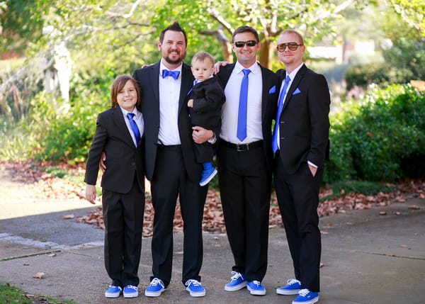 Groomsmen in suits and trainers