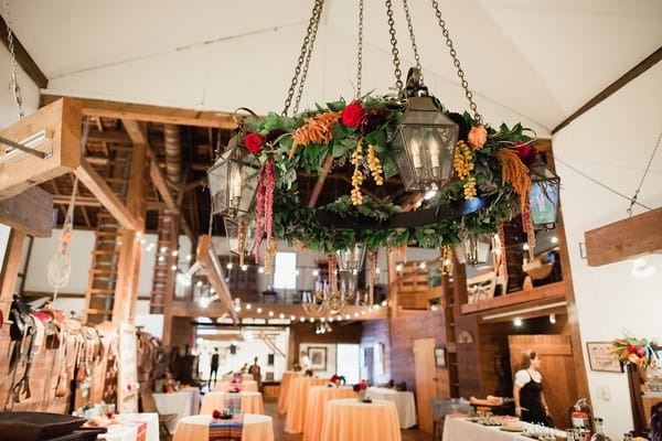 Large hanging foliage arrangement in wedding venue