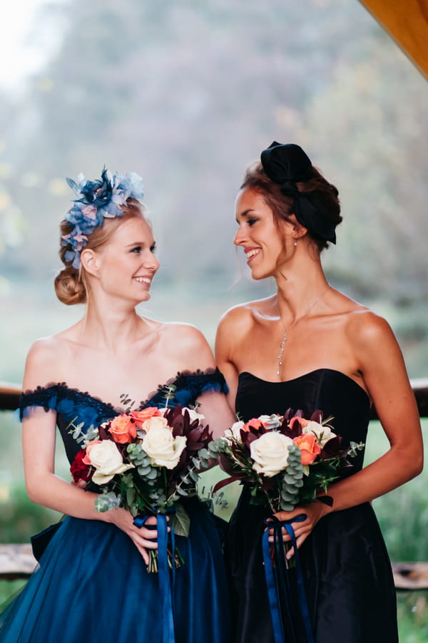 Bride and bridesmaid in blue dresses