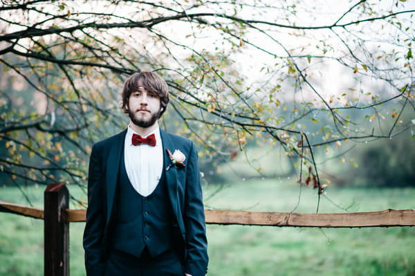 Groom with red bow tie