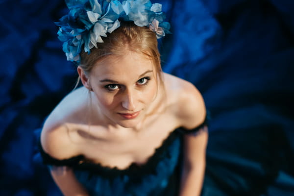 Bride in blue headpiece looking up