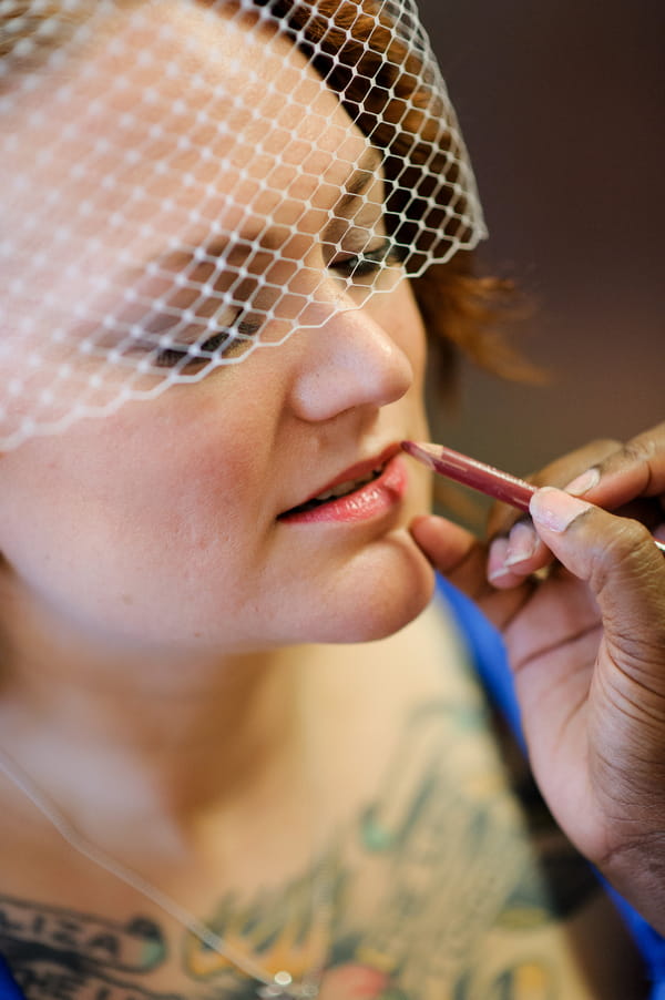Bride having lip liner applied