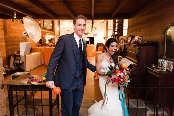 Bride and groom enter reception