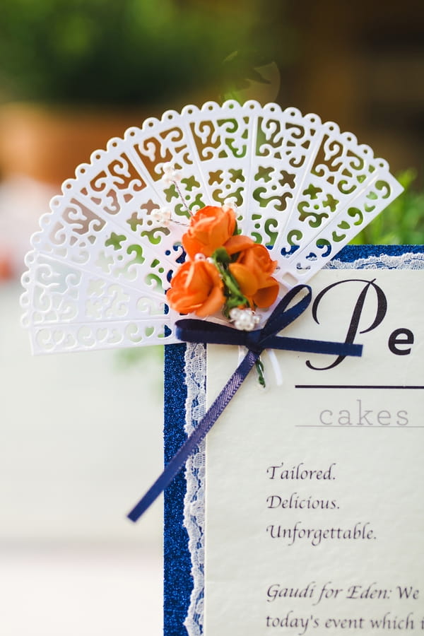 Small fan detail on corner of Spanish wedding stationery