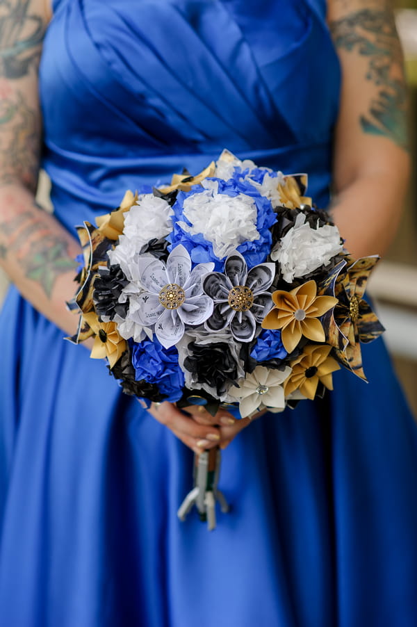 Bride holding handmade paper bouquet