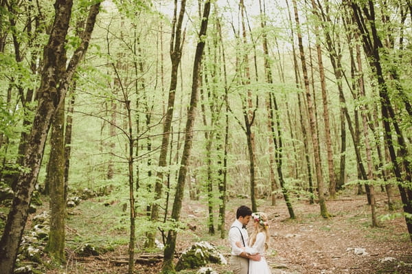 Bride and groom in woods