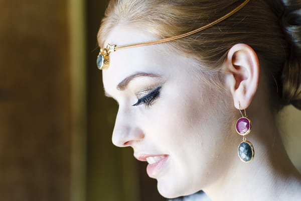 Bride with gemstone forehead chain and earrings