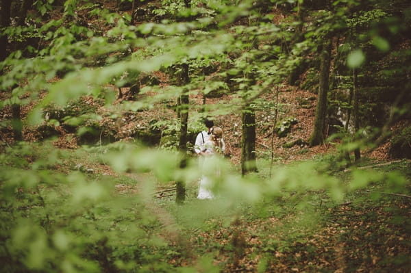 Bride and groom in woods