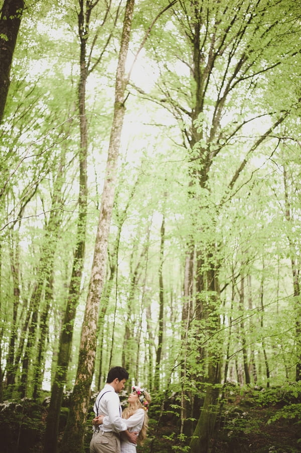 Bride and groom in woods