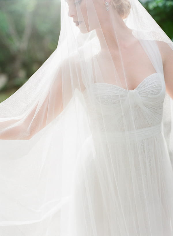 Bride covered in long veil