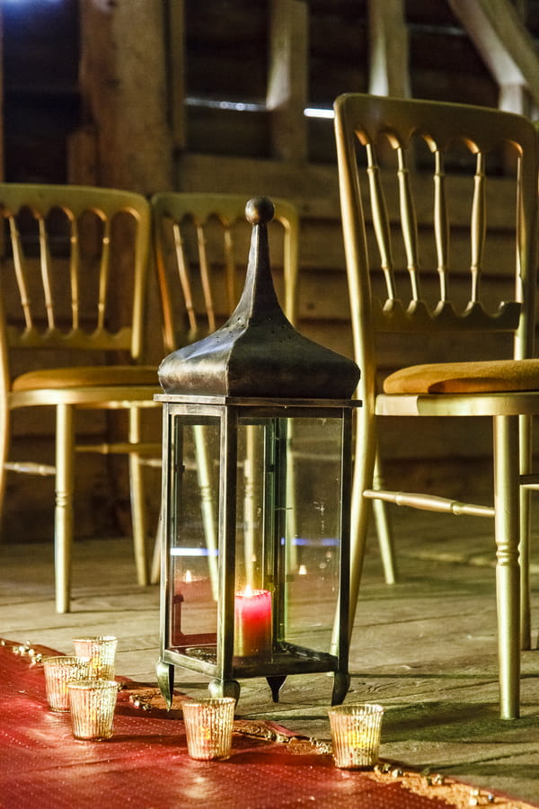 Lantern at end of wedding ceremony chairs