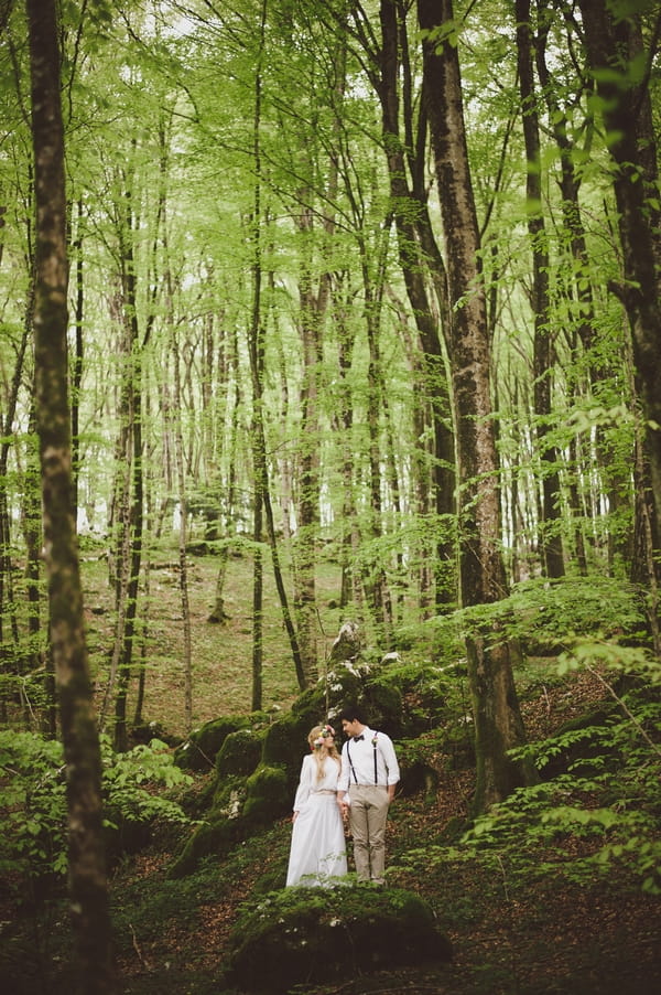 Bride and groom in woods