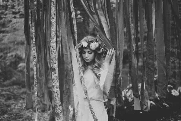 Bride walking through streamers