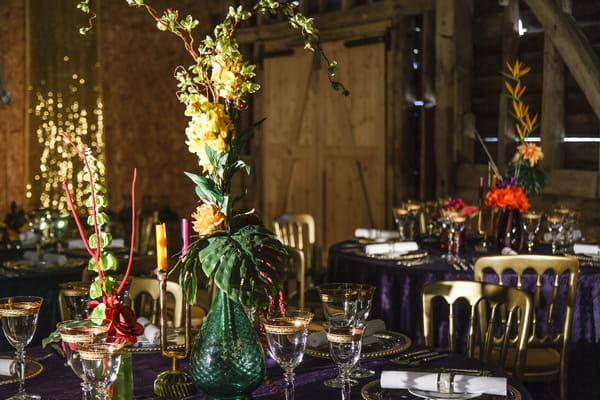 Wedding table with colourful glassware and flowers