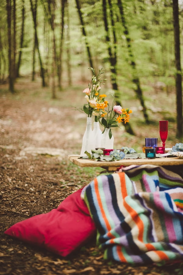 Bottles of flowers in woods