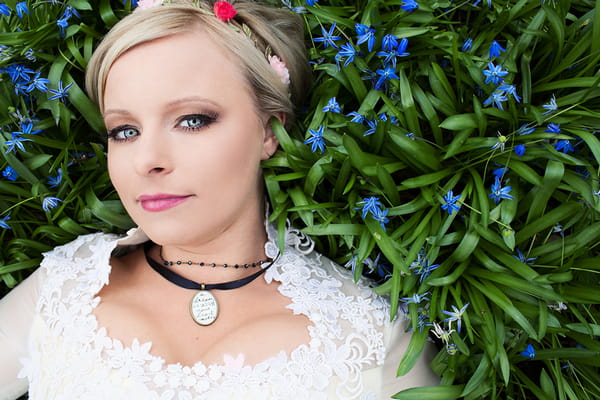 Cinderella bride laying in grass