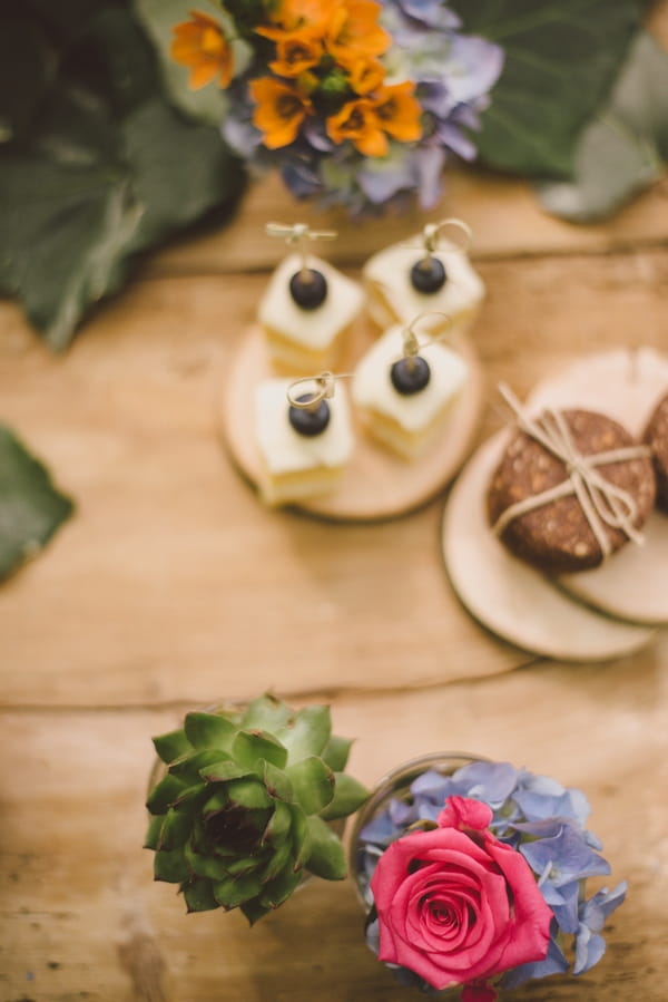 Wedding cakes and flowers on table