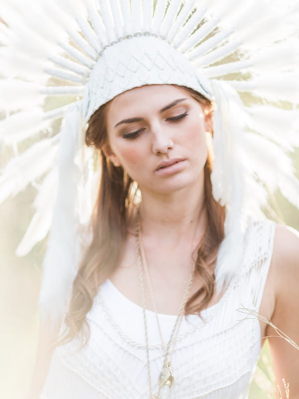 Bohemian bridesmaid with feather headdress