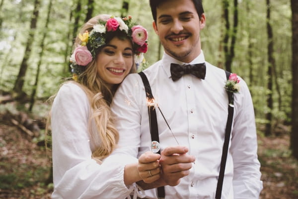 Boho bride and groom with sparklers