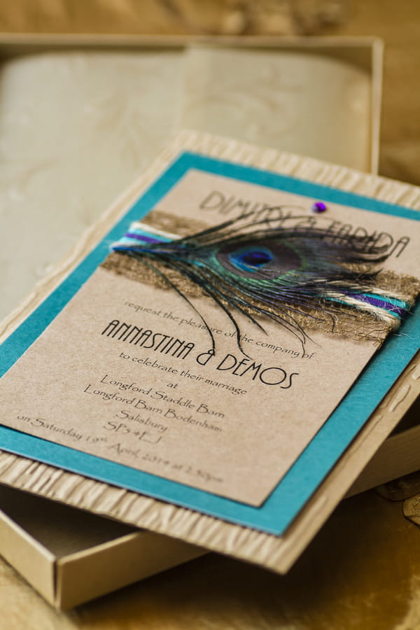 Wedding stationery with peacock feather