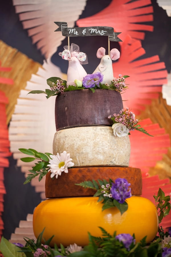 Cheese stack wedding cake with mouse cake topper