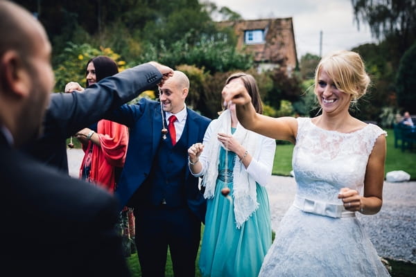 Wedding guests playing conkers