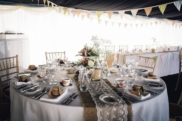 Wedding table with lace and hessian table runner