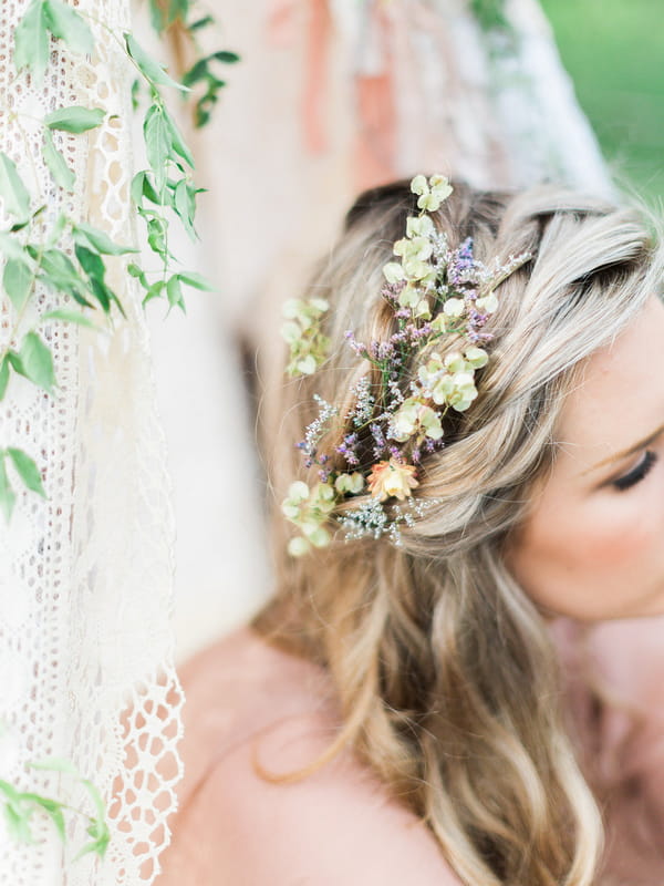 Flowers in bohemian bridesmaid's hair
