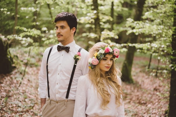 Boho bride and groom in woods