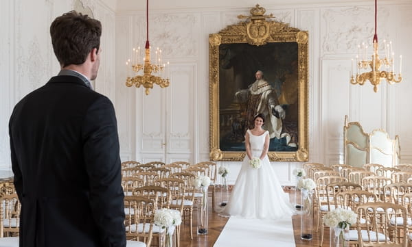 Bride standing at end of aisle