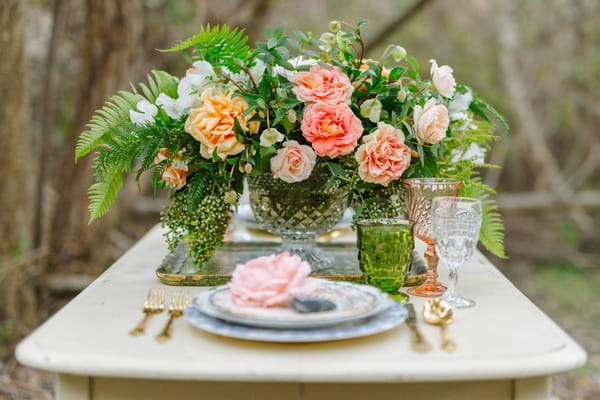 Wedding table setting with large floral centrepiece