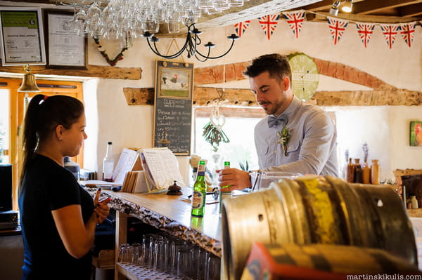 Groom at bar