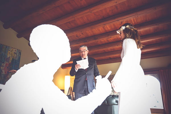 Father reading speech to bride